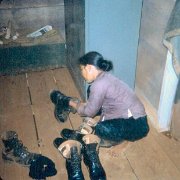 B27.  MamaSan Taking Care of Our Dirty BootsE
